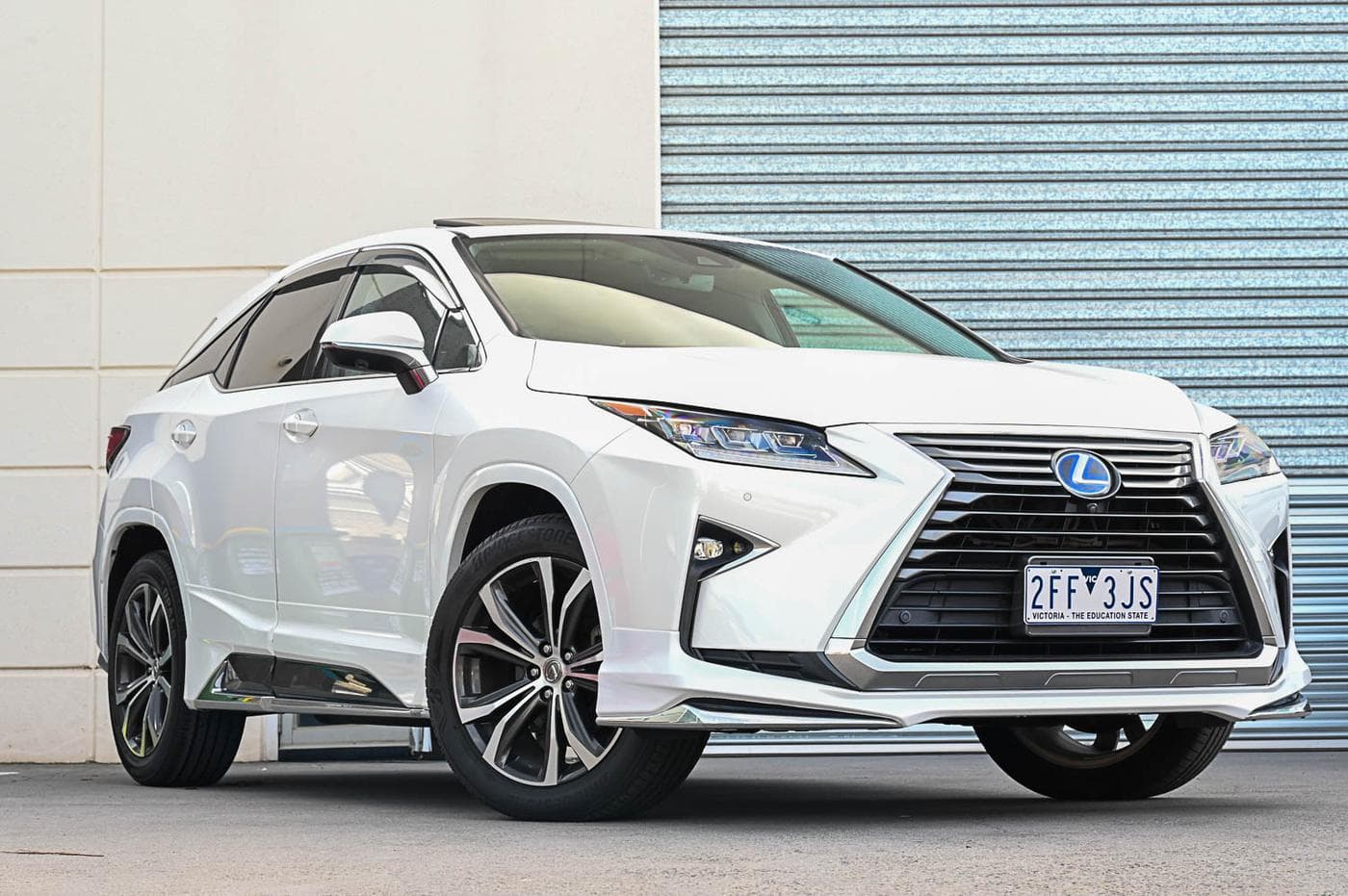 2017 Lexus RX450h in white — front three-quarter view at the Ripper Cars showroom in Springvale