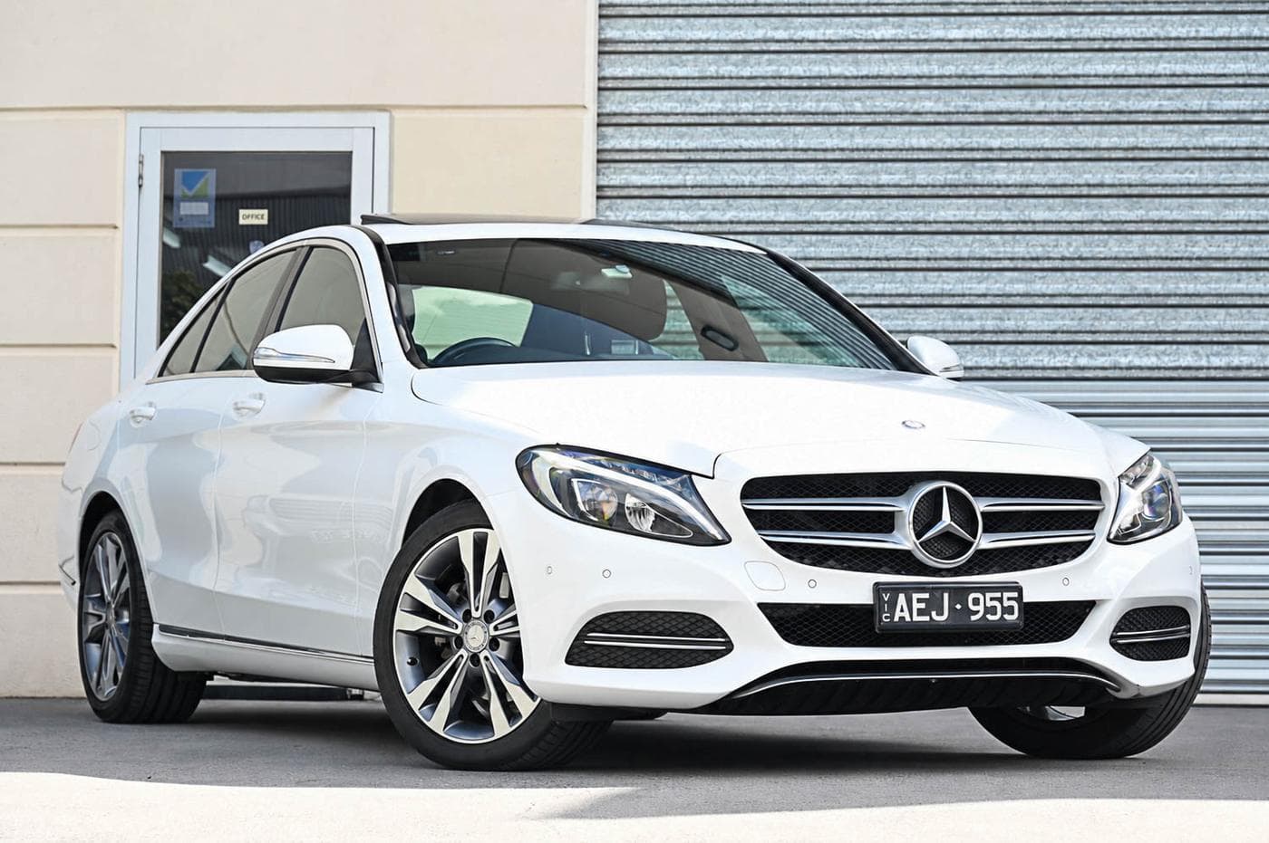 2014 Mercedes-Benz C-Class C200 in white — front three-quarter view at the Ripper Cars showroom in Springvale