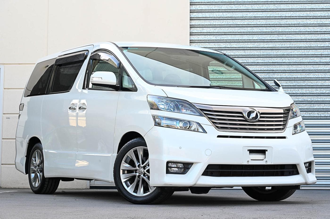 2010 Toyota Vellfire V Premium in white — front three-quarter view at the Ripper Cars showroom in Springvale