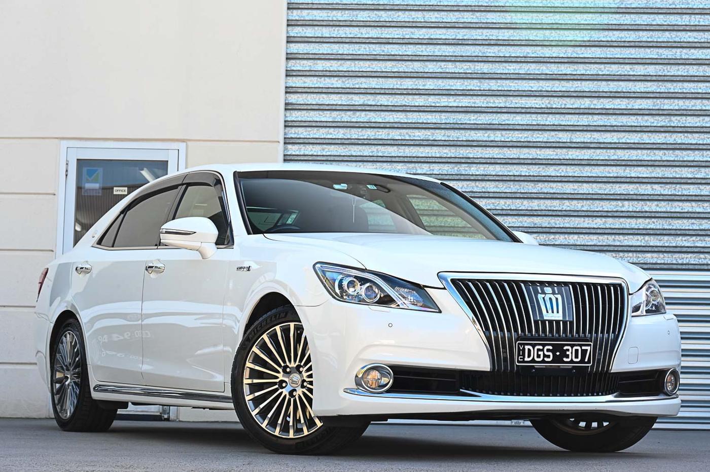 Toyota Crown in white — front three-quarter view at the Ripper Cars showroom in Springvale